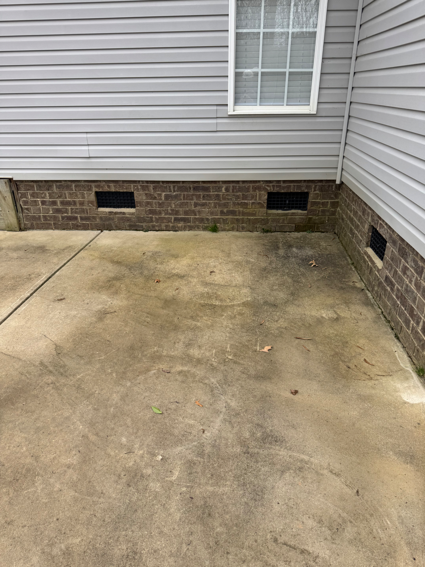 Concrete patio before pressure washing